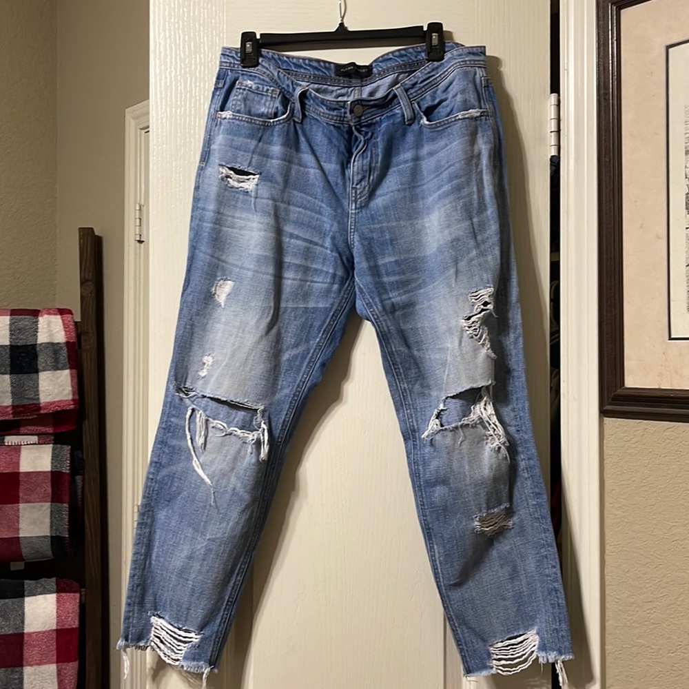 Ripped up- frayed bottom. Comfortable jeans. Relaxed